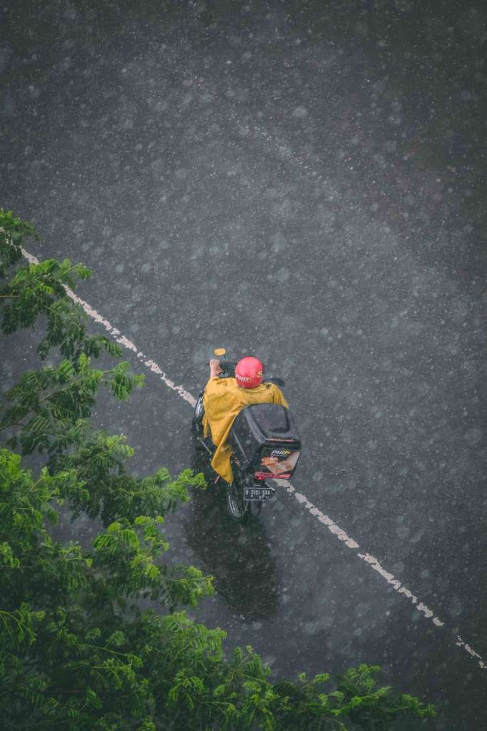 Alt text: A photo of a courier out for a delivery.