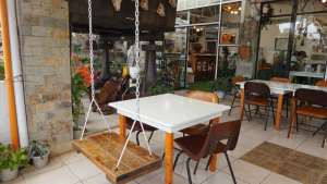 Dining Area with Swing. Photo by Leila Rolith