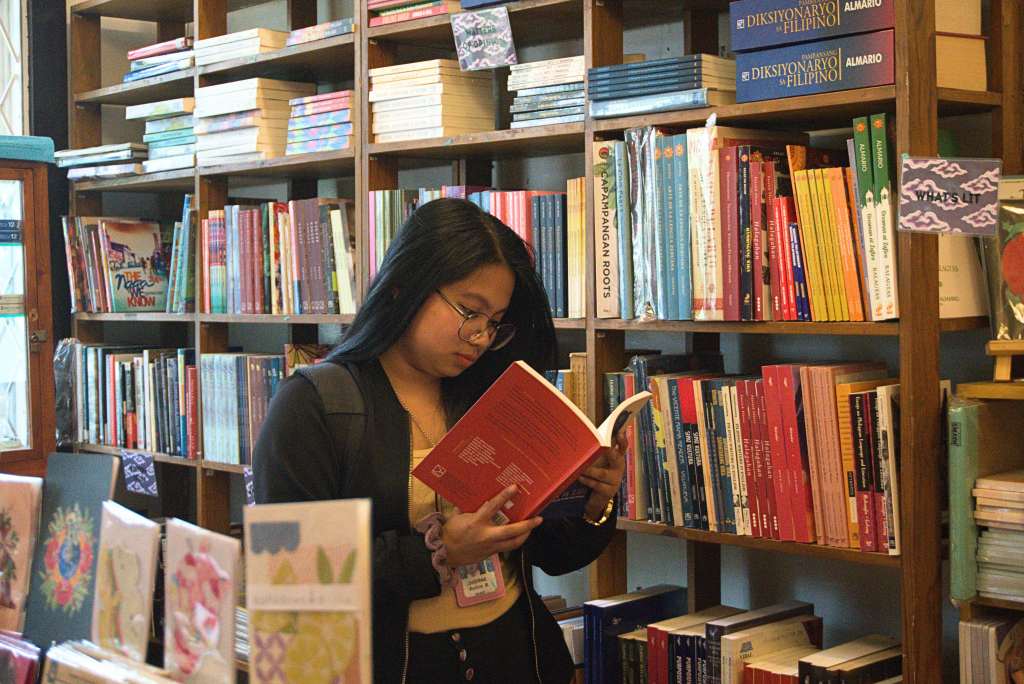 A girl reading a book inside Mt. Cloud bookshop. Photo by Leila Rolith Bulatao