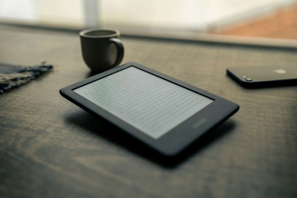 Black Kindle e-reader on a table